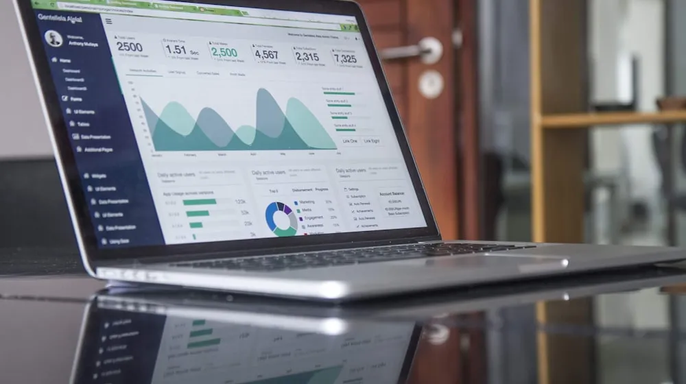 Spreadsheet modeling streaming royalty pools with calculator and headphones